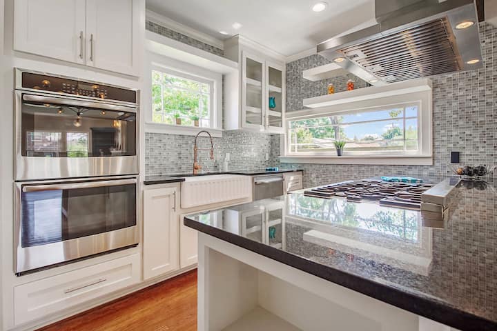 An image of a modern kitchen with sleek appliances, featuring a gas stove, refrigerator, and built-in microwave in San Jose